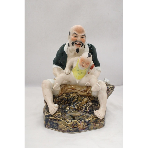 171 - A CHINESE PORCELAIN MAN WITH BABY