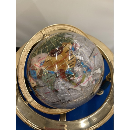 12 - A SEMI PRECIOUS STONE GLOBE ON A BRASS STAND WITH COMPASS