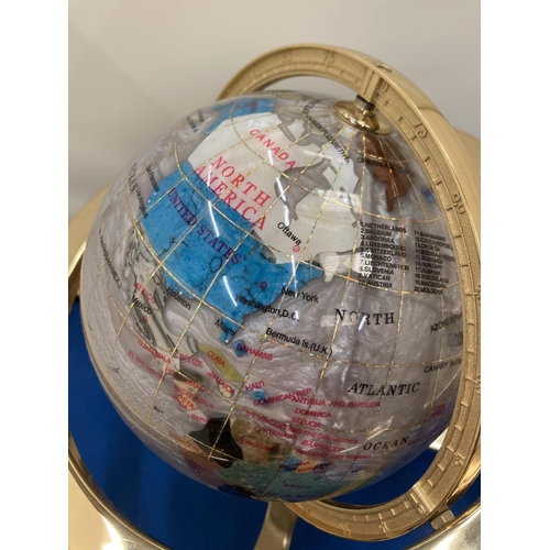 12 - A SEMI PRECIOUS STONE GLOBE ON A BRASS STAND WITH COMPASS