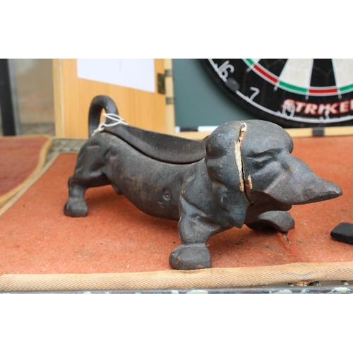 A VINTAGE CAST IRON SAUSAGE DOG DOOR STOP
