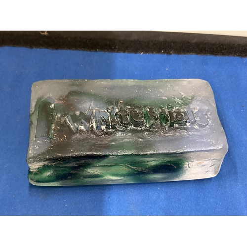 25 - A CLEAR AND GREEN GLASS ADVERTISING BLOCK, STAMPED WHITEFRIARS, 14CM X 7CM AT WIDEST POINT X 5.5CM