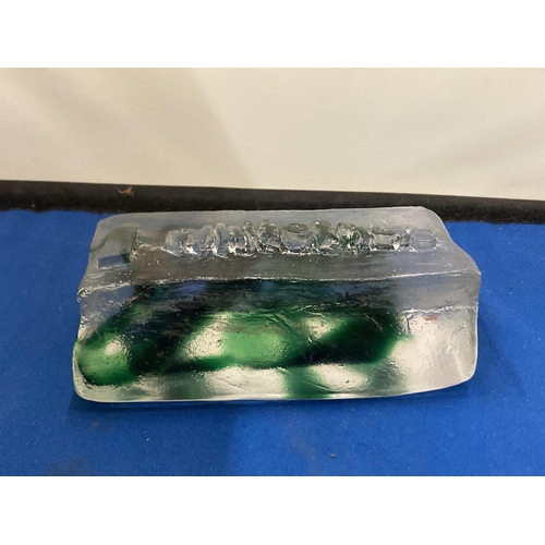 25 - A CLEAR AND GREEN GLASS ADVERTISING BLOCK, STAMPED WHITEFRIARS, 14CM X 7CM AT WIDEST POINT X 5.5CM