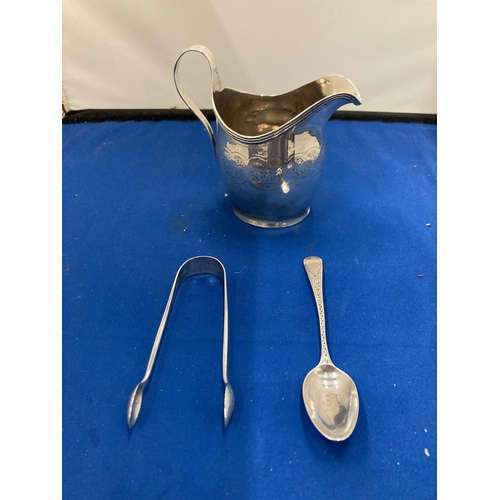 31 - THREE HALLMARKED SILVER ITEMS TO INCLUDE A JUG, TEASPOON AND A SET OF SUGAR NIPS