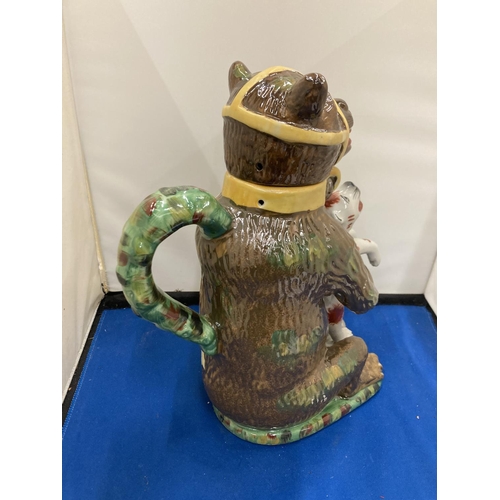 36 - A STAFFORDSHIRE BEARS GREASE ADVERTISING JUG WITH COVER DEPICTING A CHAINED BEAR CLUTCHING A SNARLIN... 