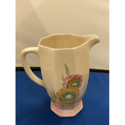 4 - A CLARICE CLIFF NEWPORT POTTERY ATHENS JUG IN THE RHODANTHE PATTERN HAND PAINTED IN YELLOWS AND PINK... 