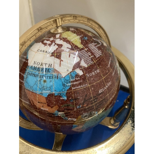 42 - A SEMI PRECIOUS STONE GLOBE ON A BRASS STAND WITH COMPASS