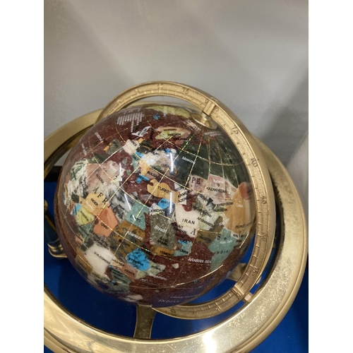 42 - A SEMI PRECIOUS STONE GLOBE ON A BRASS STAND WITH COMPASS