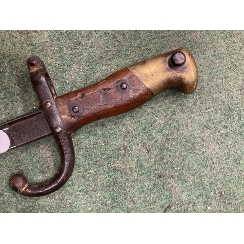 49 - A VINTAGE BRASS AND WOOD BAYONET