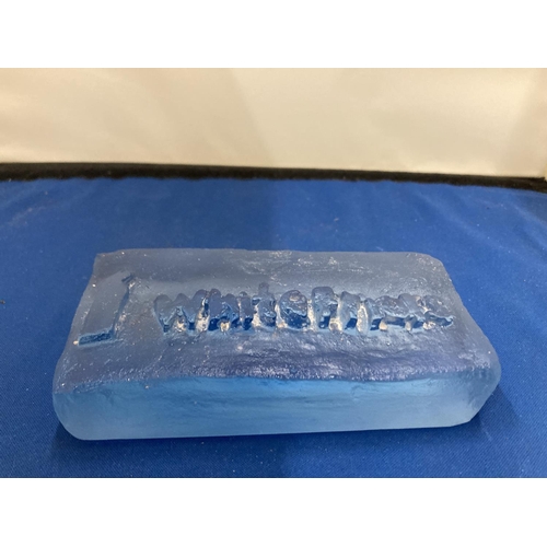 6 - A BLUE GLASS ADVERTISING BLOCK, STAMPED WHITEFRIARS 14CM X 7CM AT WIDEST POINT X 2.5CM