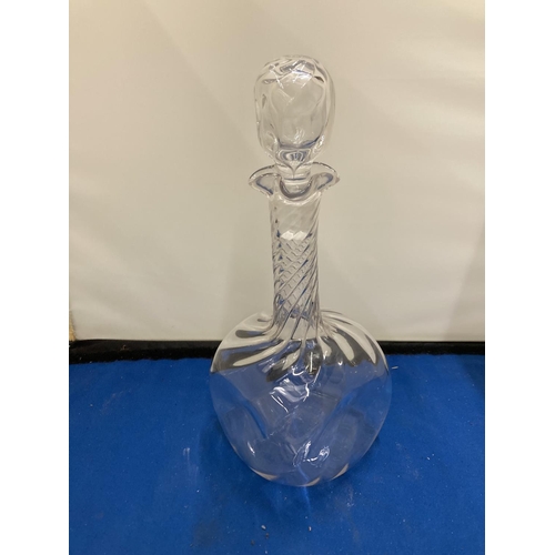 61 - A POSSIBLY JOHN WALSH GLASS DECANTER WITH DIMPLES TO THE SIDE AND A TWISTED NECK WITH FOUR POURING S... 