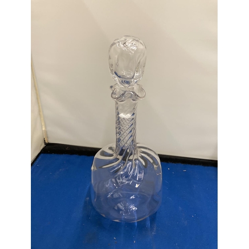 61 - A POSSIBLY JOHN WALSH GLASS DECANTER WITH DIMPLES TO THE SIDE AND A TWISTED NECK WITH FOUR POURING S... 