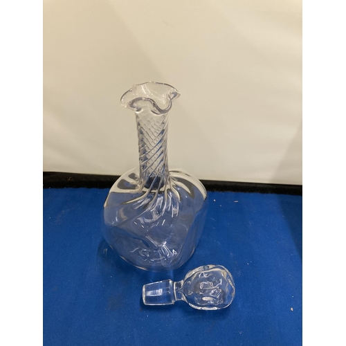 61 - A POSSIBLY JOHN WALSH GLASS DECANTER WITH DIMPLES TO THE SIDE AND A TWISTED NECK WITH FOUR POURING S... 