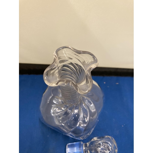 61 - A POSSIBLY JOHN WALSH GLASS DECANTER WITH DIMPLES TO THE SIDE AND A TWISTED NECK WITH FOUR POURING S... 