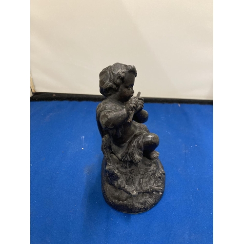 62A - A RESIN FIGURE OF A GIRL PLAYING A FLUTE