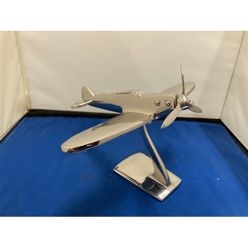 67 - A CHROME MODEL OF A SPITFIRE ON A STAND