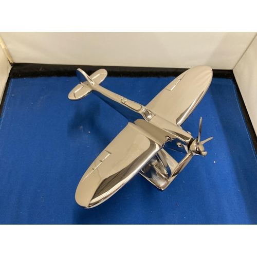 67 - A CHROME MODEL OF A SPITFIRE ON A STAND