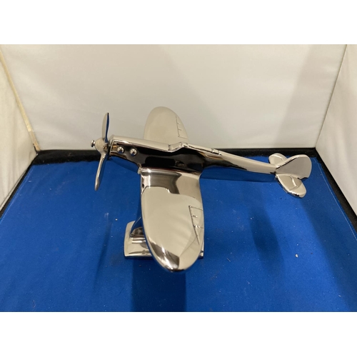 67 - A CHROME MODEL OF A SPITFIRE ON A STAND