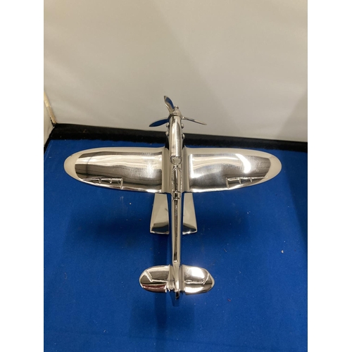 67 - A CHROME MODEL OF A SPITFIRE ON A STAND