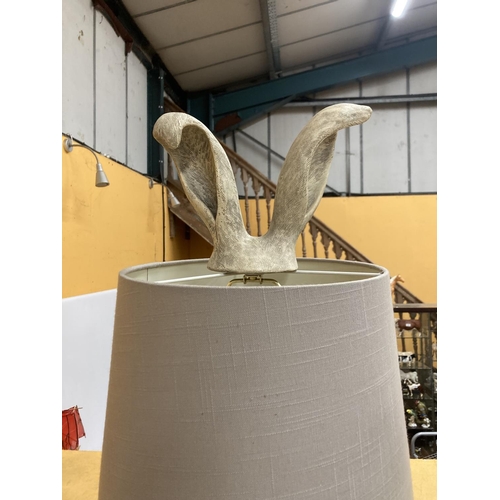 71 - A LARGE TABLE LAMP DEPICTING A HARE WITH EARS COMING OUT FROM A GREY SHADE