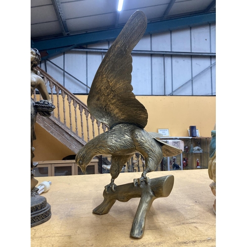 73 - A LARGE HEAVY BRASS EAGLE ON A LOG