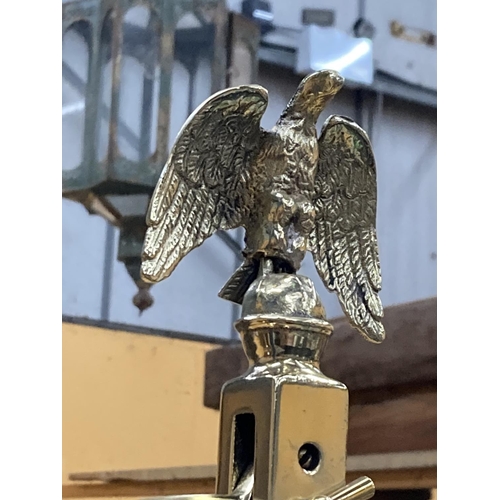 81 - A PAIR OF BRASS BALANCE SCALES WITH AN EAGLE  DECORATION