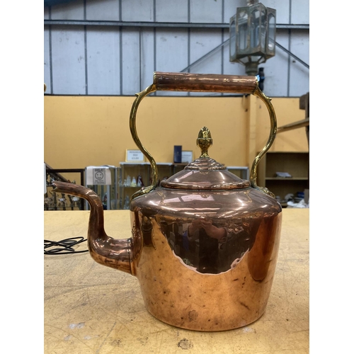 84 - TWO VINTAGE COPPER AND BRASS KETTLES BOTH WITH ACORN FINIALS