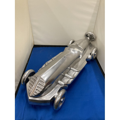 99 - A LARGE CHROME ART DECO RACING CAR, LENGTH APPROX 55CM