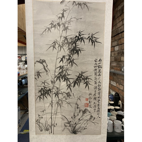 1009 - AN ORIENTAL SCROLL WITH BAMBOO DESIGN AND CHARACTER MARKS, ON PAPER BACKED MATERIAL, 60CM X 155CM