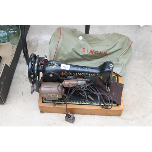 1708 - AN ELECTRIC SINGER SEWING MACHINE WITH FOOT PEDAL AND CARRY BAG