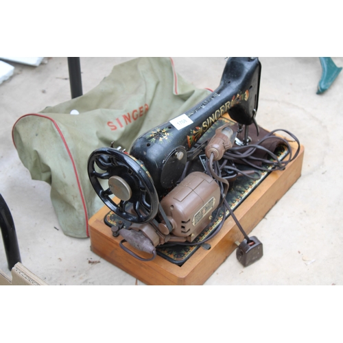 1708 - AN ELECTRIC SINGER SEWING MACHINE WITH FOOT PEDAL AND CARRY BAG