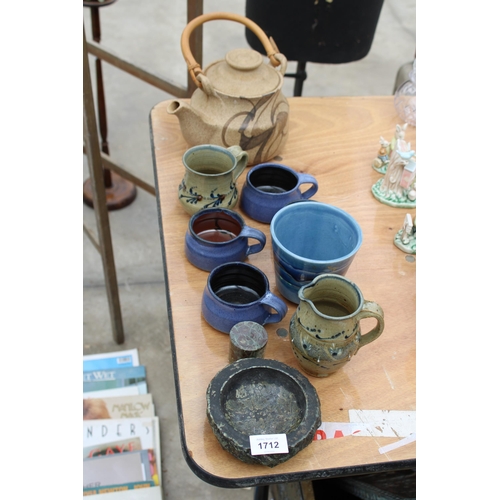 1712 - AN ASSORTMENT OF STUDIO POTTERY TO INCLUDE A KETTLE, JUGS AND CUPS ETC