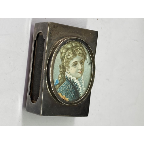 65 - A HALLMARKED CHESTER SILVER MATCHBOX HOLDER WITH PORTRAIT TO THE TOP