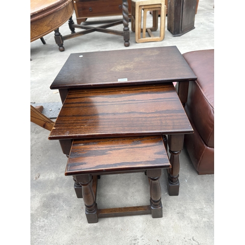 2883 - A NEST OF THREE OAK TABLES, SMALL STOOL AND CONCORDE POUFFE