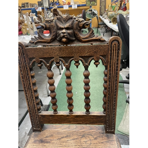 84A - A CARVED WOODEN HALL CHAIR