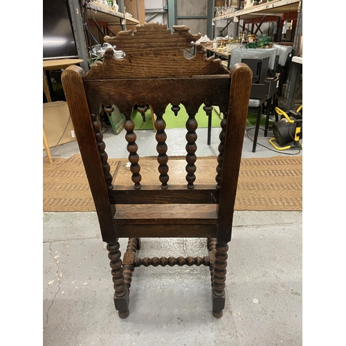 84A - A CARVED WOODEN HALL CHAIR