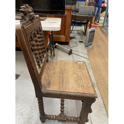 84A - A CARVED WOODEN HALL CHAIR