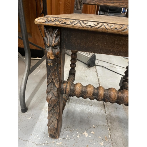 84A - A CARVED WOODEN HALL CHAIR