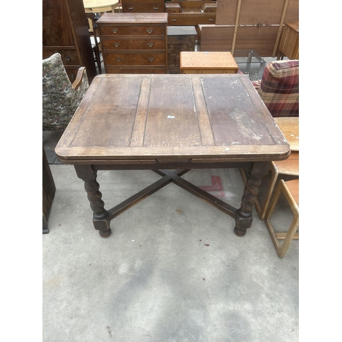 2906 - A MID 20TH CENTURY OAK DRAW LEAF DINING TABLE ON BARLEY TWIST LEGS