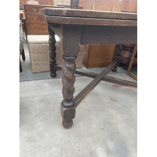 2906 - A MID 20TH CENTURY OAK DRAW LEAF DINING TABLE ON BARLEY TWIST LEGS