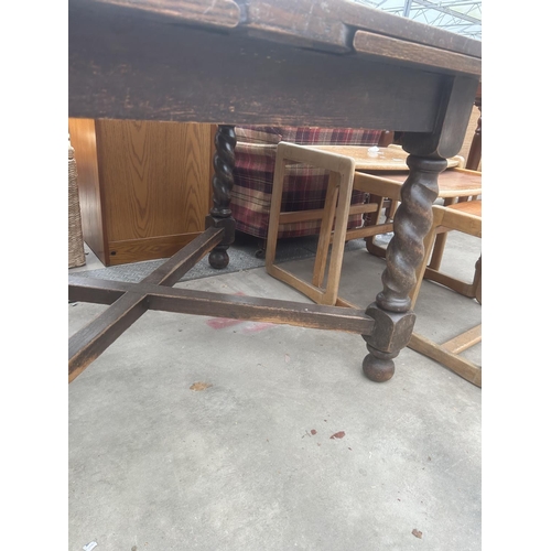 2906 - A MID 20TH CENTURY OAK DRAW LEAF DINING TABLE ON BARLEY TWIST LEGS