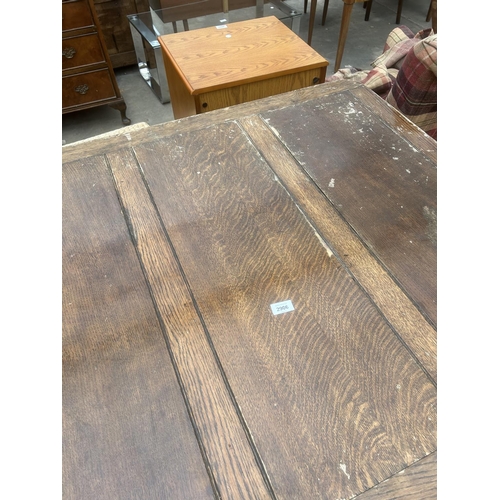 2906 - A MID 20TH CENTURY OAK DRAW LEAF DINING TABLE ON BARLEY TWIST LEGS