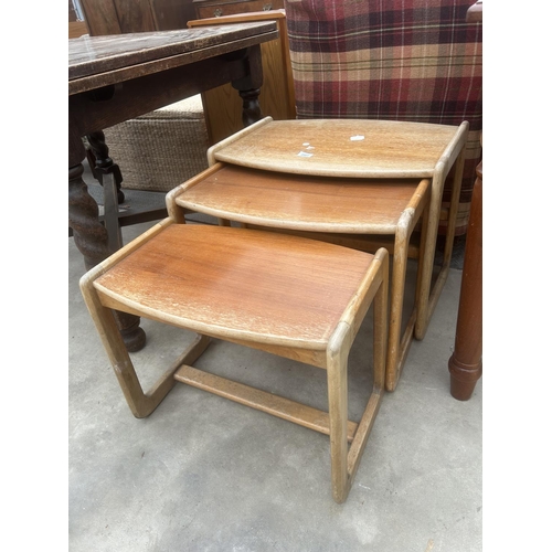 2907 - A NEST OF THREE RETRO TEAK TABLES