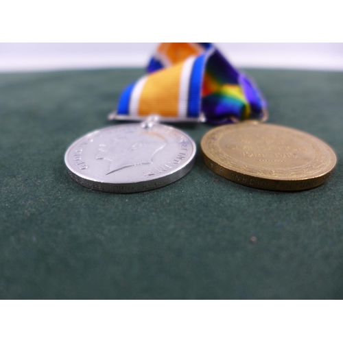 304 - A WORLD WAR I MEDAL PAIR AWARDED TO 199283 GUNNER E EBBORN ROYAL ARTILLERY