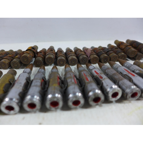 362 - TWO L A24 FIRED MACHINE GUN BELTS AND A LARGE QUANTITY OF FIRED BULLET CASINGS ETC