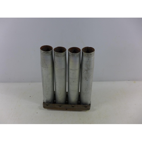 363 - A CLIP OF FOUR FIRED MARK 3 40MM SHELL CASES