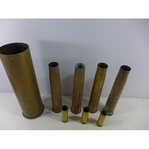 364 - A COLLECTION OF EIGHT FIRED BRASS SHELL CASES, HEIGHT RANGE FROM 11 TO 38.5CM