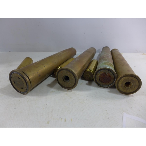 364 - A COLLECTION OF EIGHT FIRED BRASS SHELL CASES, HEIGHT RANGE FROM 11 TO 38.5CM