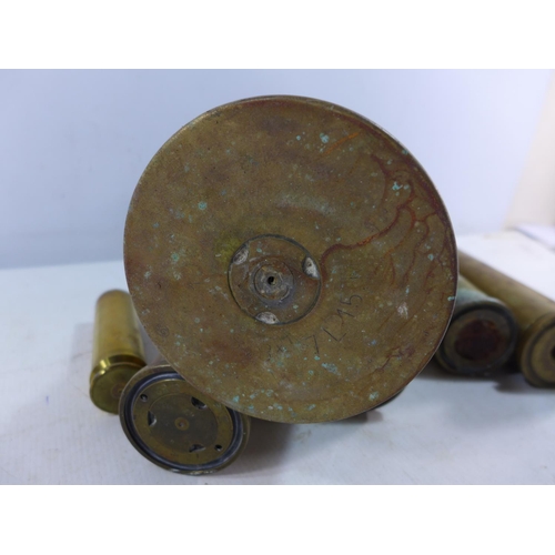 364 - A COLLECTION OF EIGHT FIRED BRASS SHELL CASES, HEIGHT RANGE FROM 11 TO 38.5CM