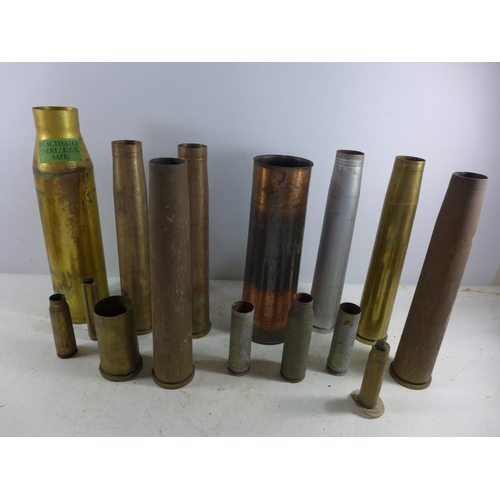 371 - A COLLECTION OF FIFTEEN FIRED BRASS SHELL CASES SOME WITH EAGLE AND SWASTIKA MARKS, HEIGHTS FROM 11C... 