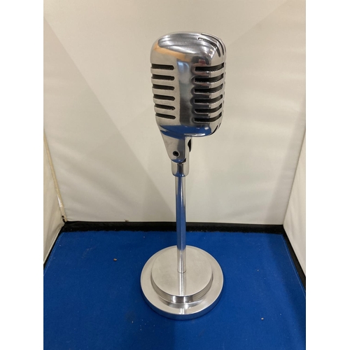 27 - A CHROME MICROPHONE ON A STAND